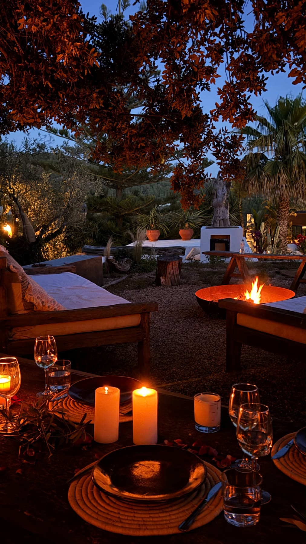 The firepit and low sofas at dusk