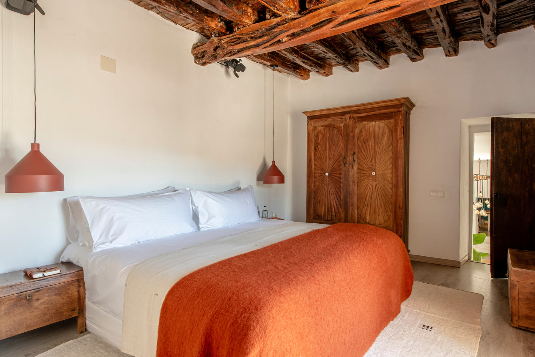 A finca room under the original two-hundred-year-old sabina beams